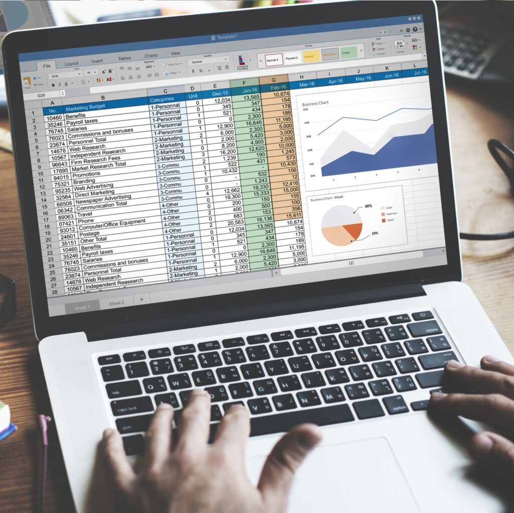 closeup-hands-using-computer-laptop-with-screen-showing-analysis-data